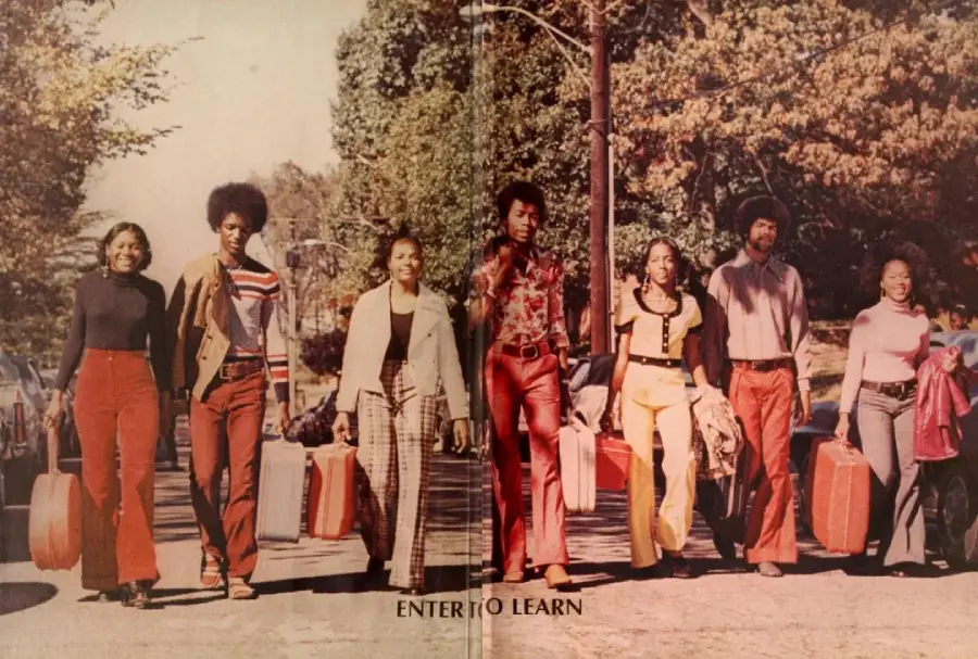 Seven young adults in 1970s clothing walk down a tree-lined street with suitcases, smiling and looking forward. The phrase "ENTER TO LEARN" is visible at the bottom.