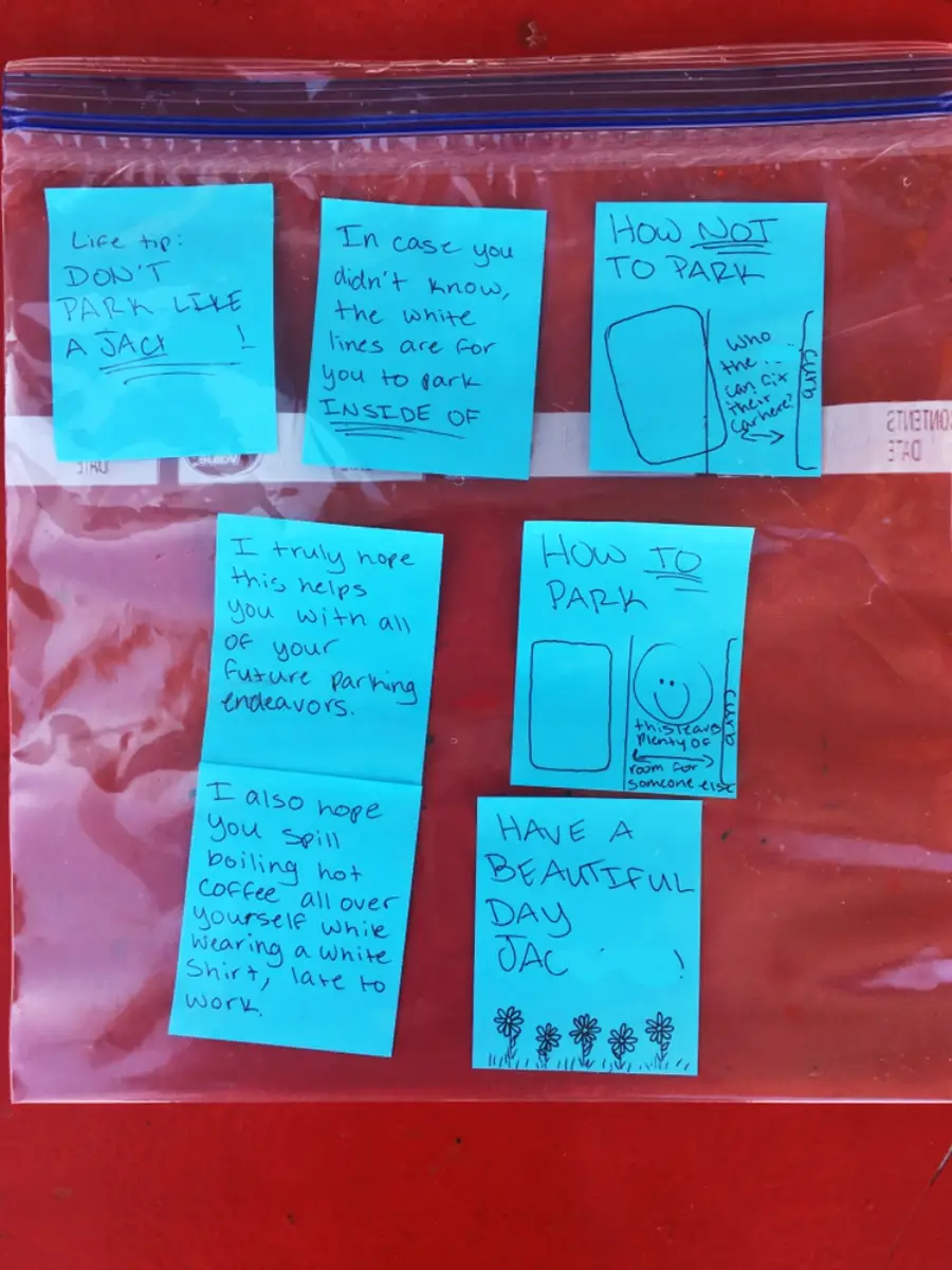 A plastic bag holds blue sticky notes with snarky messages about bad parking, including diagrams, insults, and a wish for the recipient to have a bad day. The notes are addressed to "Jac.