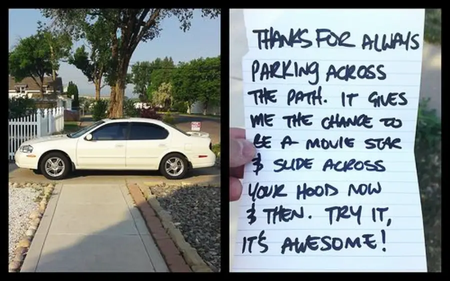A white car blocks a sidewalk. Next to it, a handwritten note sarcastically thanks the driver for parking there, saying it lets others slide across the car’s hood like a movie star and suggests they try it.