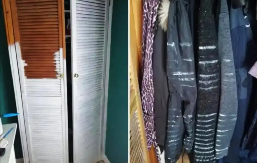 A closet door partially painted white is open, revealing several dark-colored coats inside with white paint streaks across them, likely from contact with the wet door.