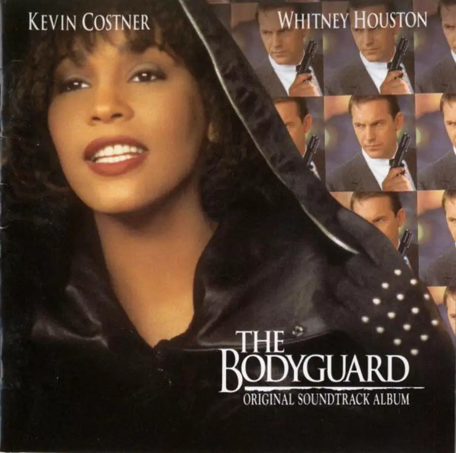 Album cover for "The Bodyguard" soundtrack featuring a close-up of a woman in a hooded cloak and a collage of a man holding a gun. The names Kevin Costner and Whitney Houston are displayed at the top.