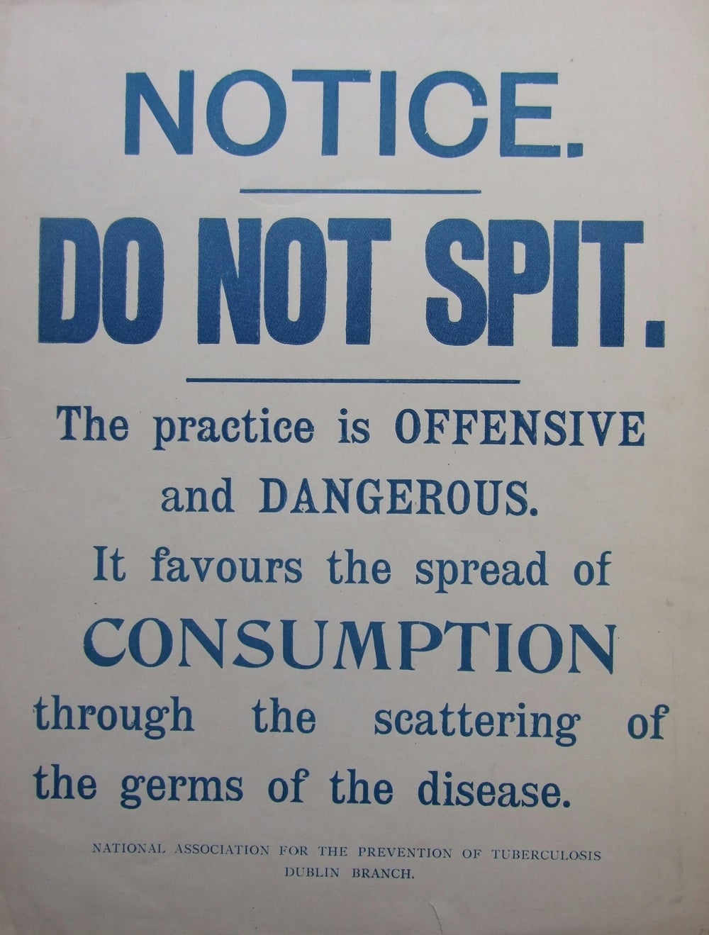A vintage sign reads: “NOTICE. DO NOT SPIT. The practice is OFFENSIVE and DANGEROUS. It favours the spread of CONSUMPTION through scattering germs.” National Association for the Prevention of Tuberculosis.