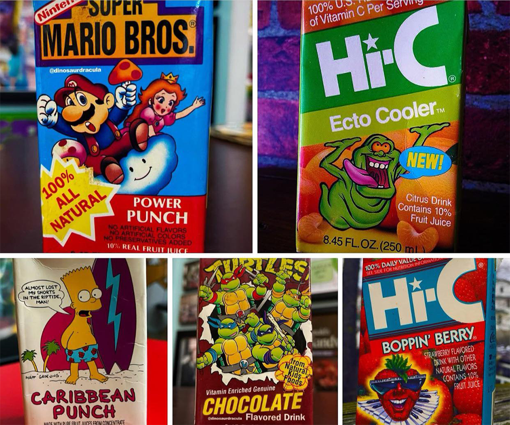 Five colorful juice and drink boxes featuring pop culture characters: Mario, Slimer from Ghostbusters, Bart Simpson, Teenage Mutant Ninja Turtles, and another Hi-C box with a moon and waves design.
