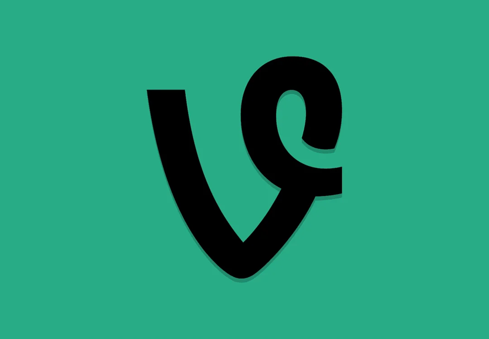 A black Vine logo resembling a stylized “V” and “9” on a solid green background.