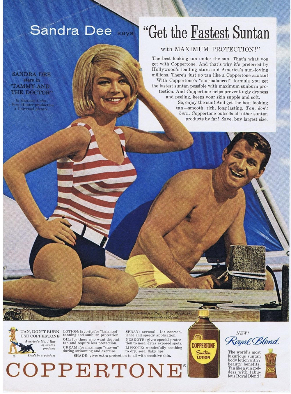 A smiling woman in a striped swimsuit poses on a beach next to a smiling man in swim trunks. Both are in front of a blue and white striped sail. The ad promotes Coppertone suntan lotion.