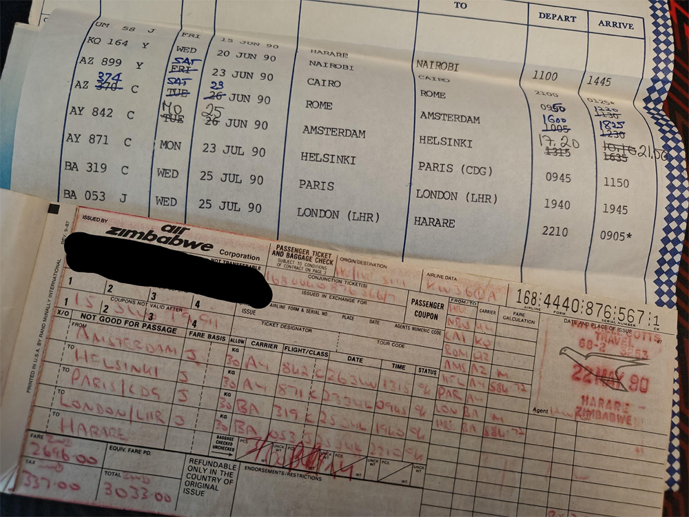 Two vintage airline documents: a typed flight itinerary with destinations and dates, and a handwritten Air Zimbabwe Corporation ticket with similar travel details, both partially overlapping and containing travel information from July 1990.