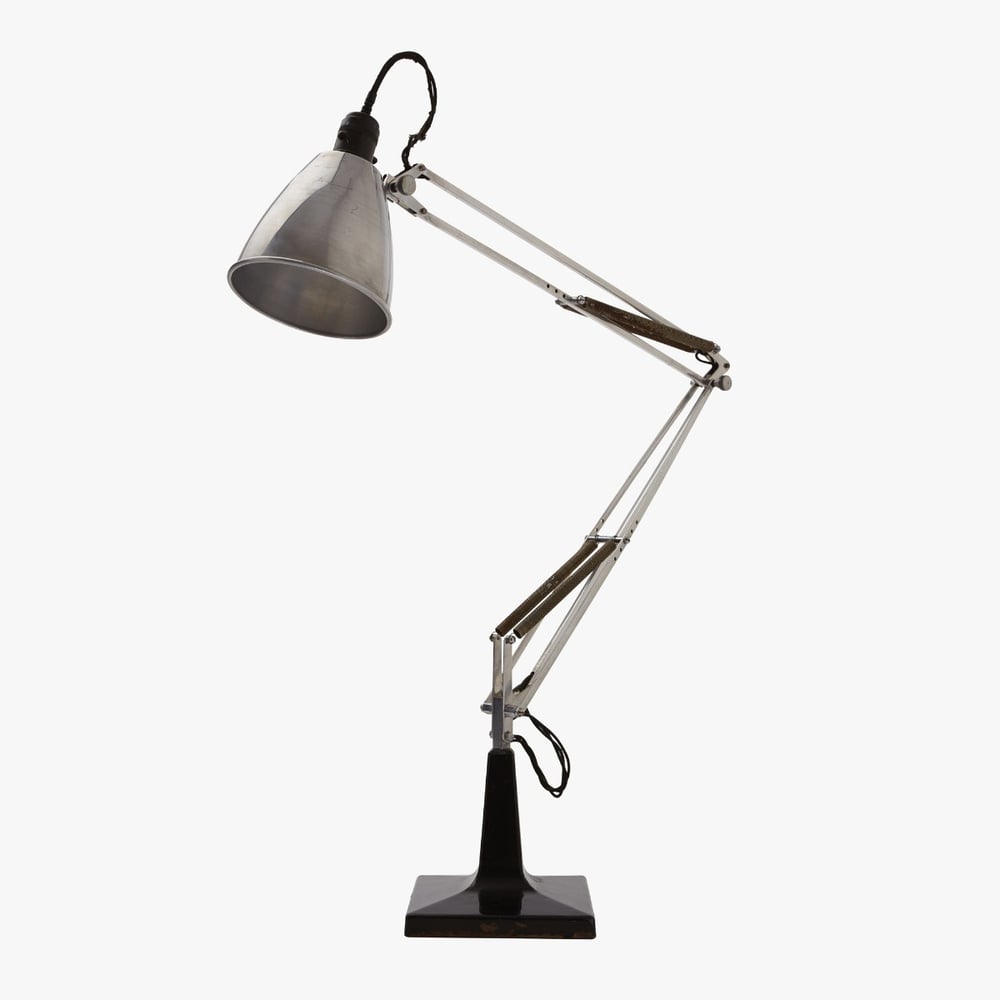 A silver adjustable desk lamp with a black base and exposed wiring, shown against a plain white background.