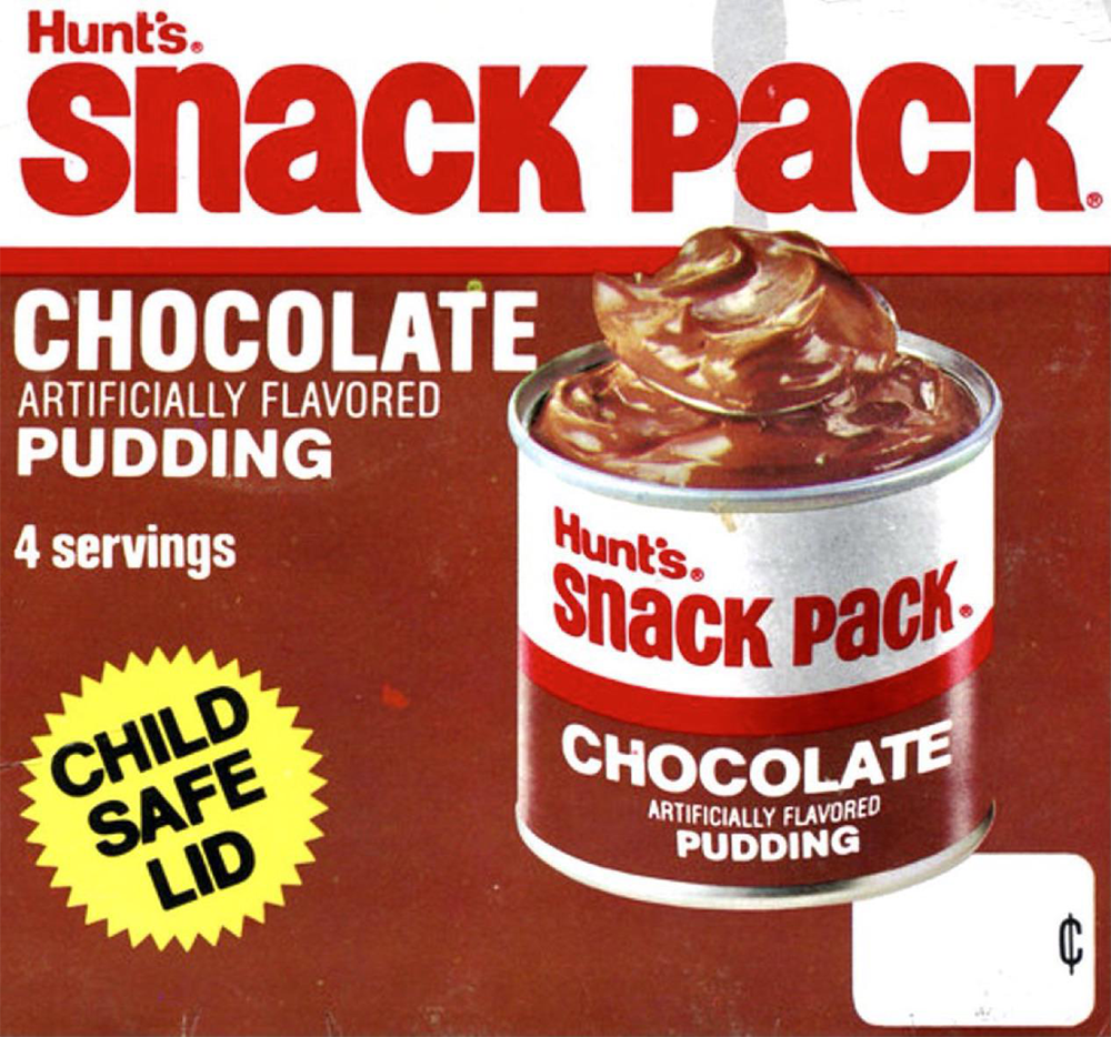 A box of Hunt’s Snack Pack chocolate artificially flavored pudding, featuring a can with pudding and a yellow “Child Safe Lid” label. The box advertises 4 servings and shows a blank price tag.