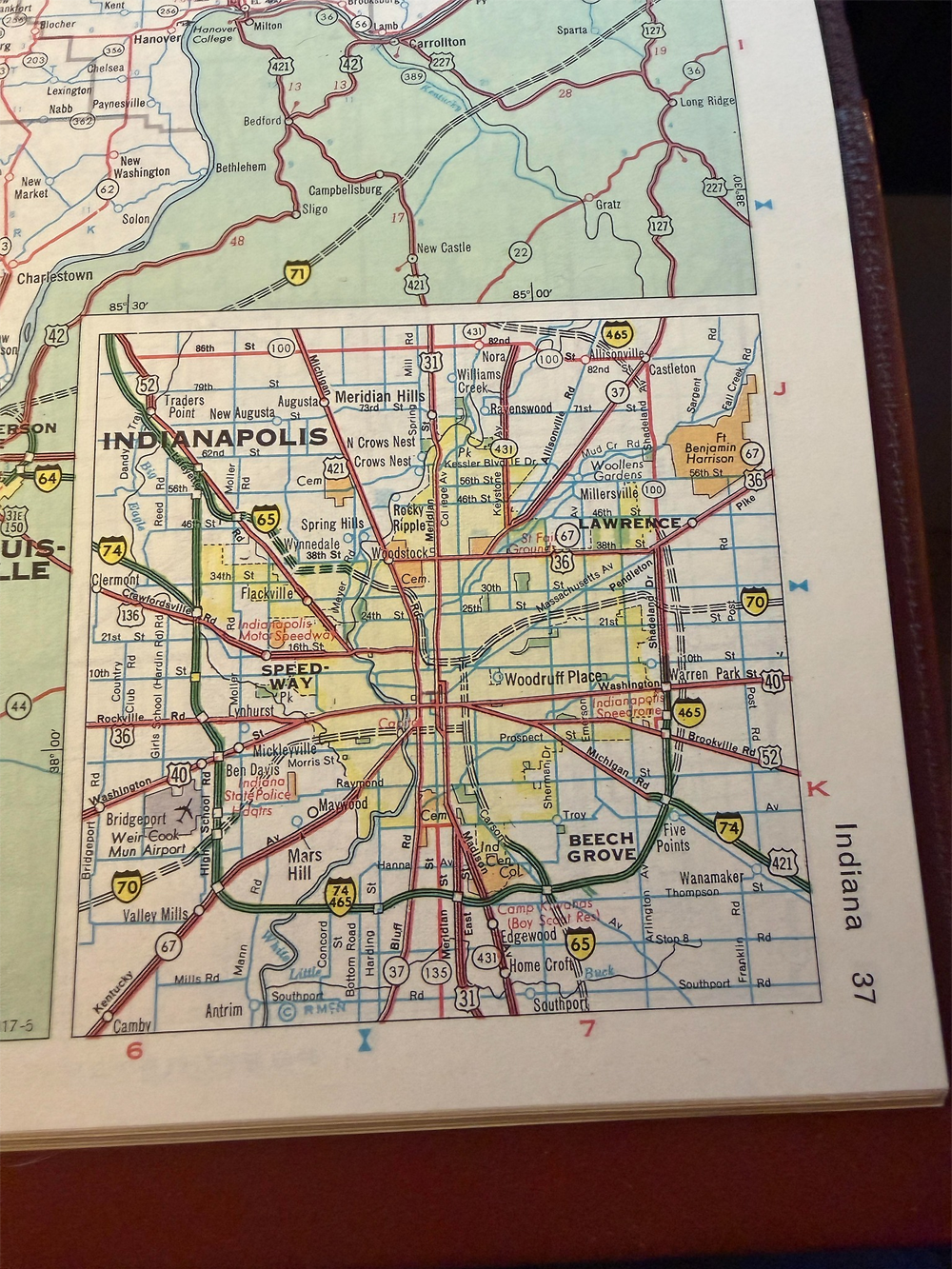 A detailed map of Indianapolis, Indiana, showing highways, major roads, and nearby cities like Beech Grove and Speedway, with clear labels and colored routes.