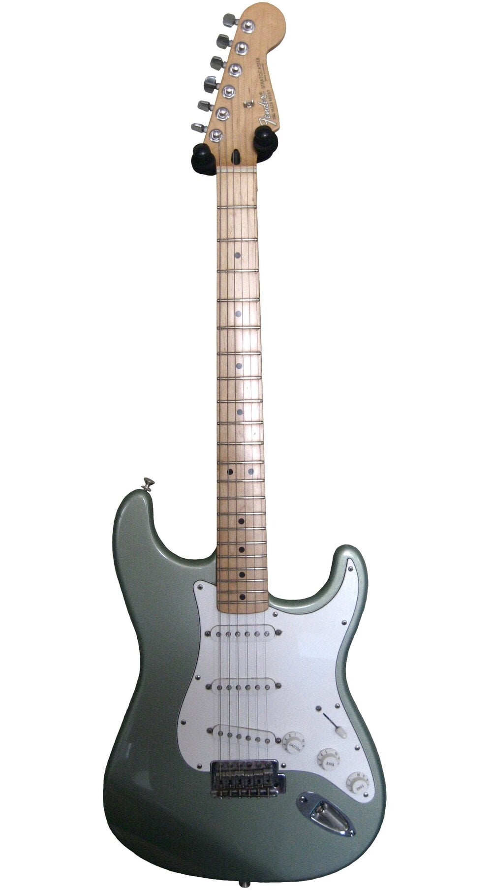 Electric guitar with a light green body, white pickguard, six control knobs, and a maple neck and fretboard. The headstock has tuning pegs and a visible logo.