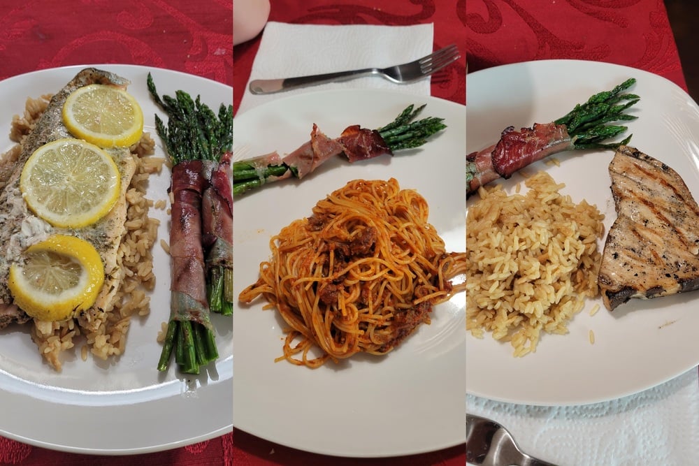 Three plates of food: lemon-topped fish with asparagus and rice, spaghetti with meat sauce and asparagus wrapped in prosciutto, and grilled chicken with rice and prosciutto-wrapped asparagus. Each plate is set on a table.