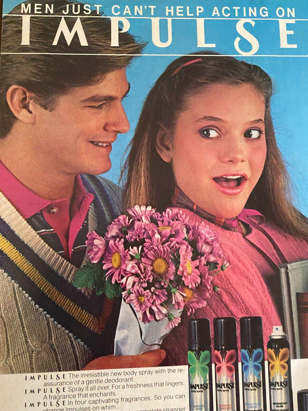 A man in a sweater gives a surprised woman a bouquet of flowers. The text above says, “Men just can’t help acting on IMPULSE.” Four cans of Impulse body spray are shown at the bottom.