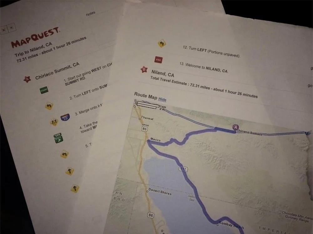 Two printed MapQuest directions: one page lists steps for a trip to Niland, CA, and the other shows a map with a highlighted driving route around the Salton Sea.