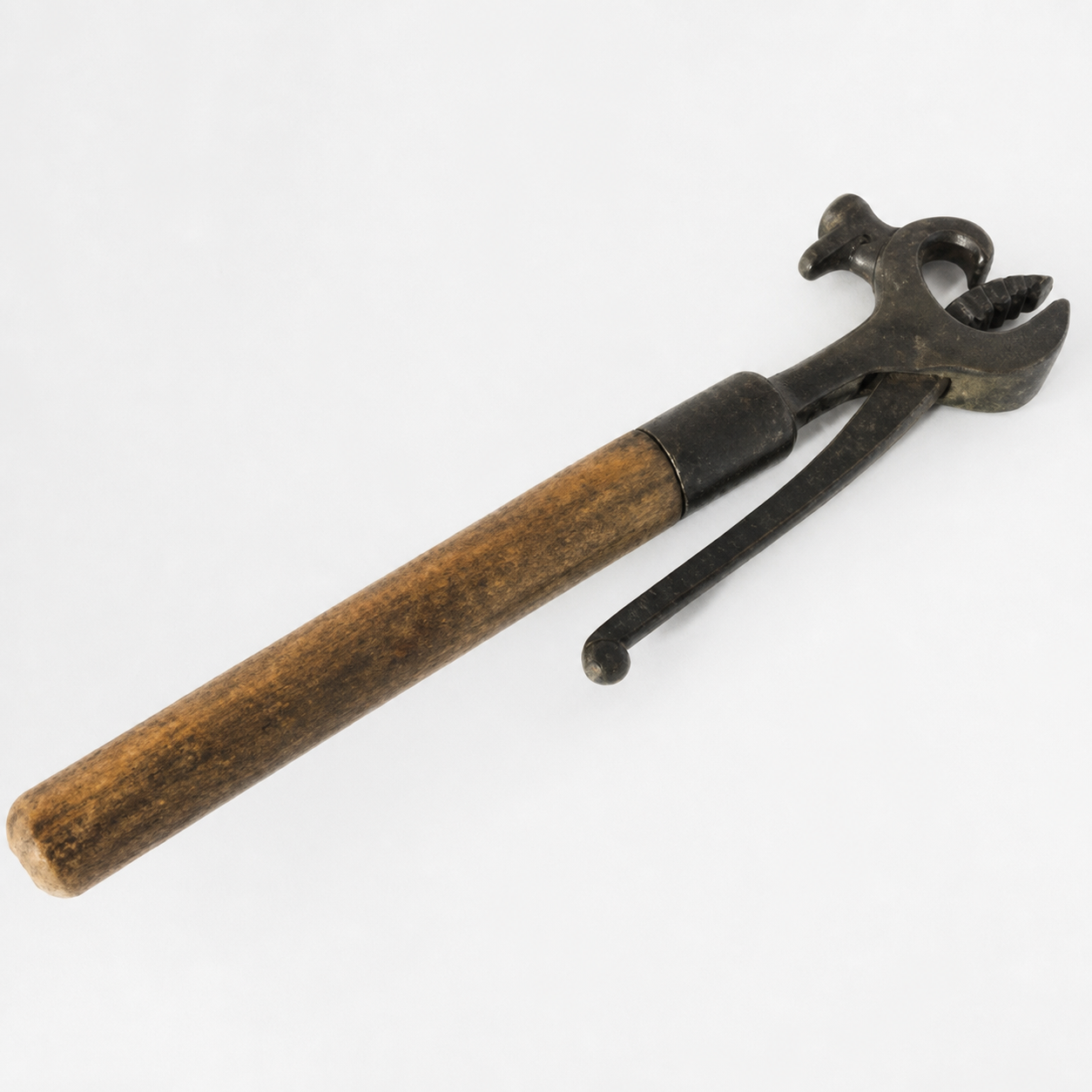 A vintage tool with a wooden handle and a metal head, featuring a curved jaw and an extended lever, set against a white background.