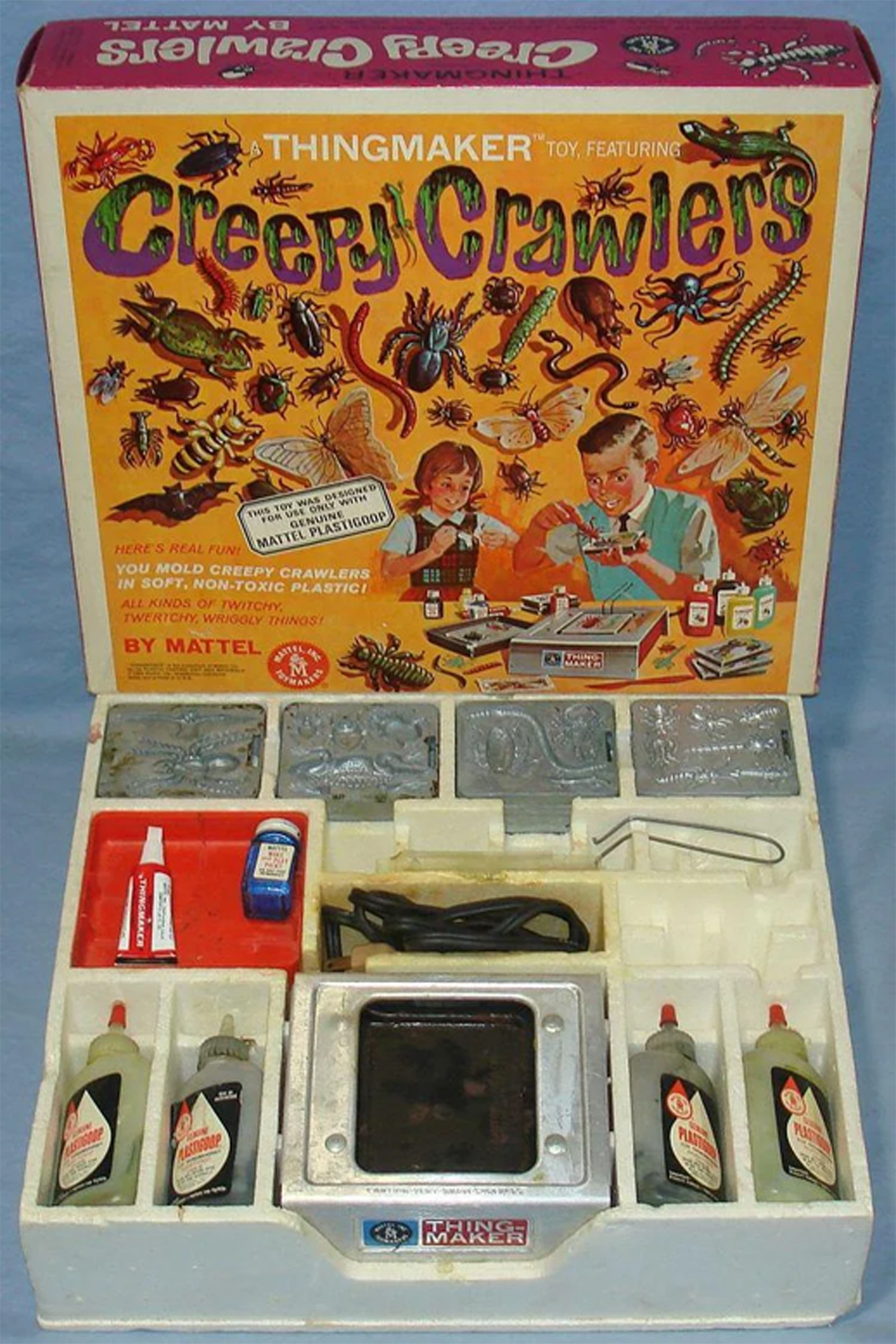 Vintage Creepy Crawlers Thingmaker toy set by Mattel, showing an illustrated box with bugs, molds, bottles of Plastigoop, tools, and a metal heating device for making rubber bugs.