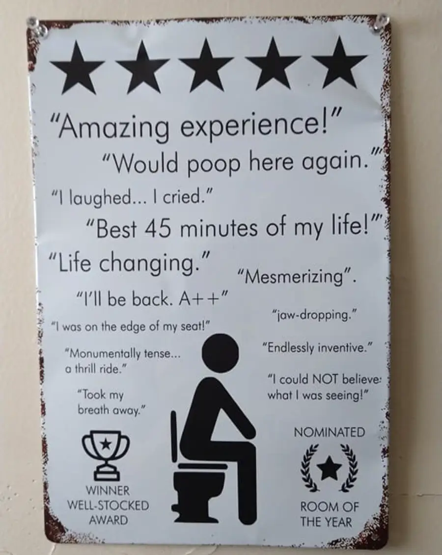 A humorous sign with five stars and quotes praising a restroom experience, featuring a stick figure on a toilet and awards for “Well-stocked” and “Room of the Year.” The sign looks vintage with a distressed border.
