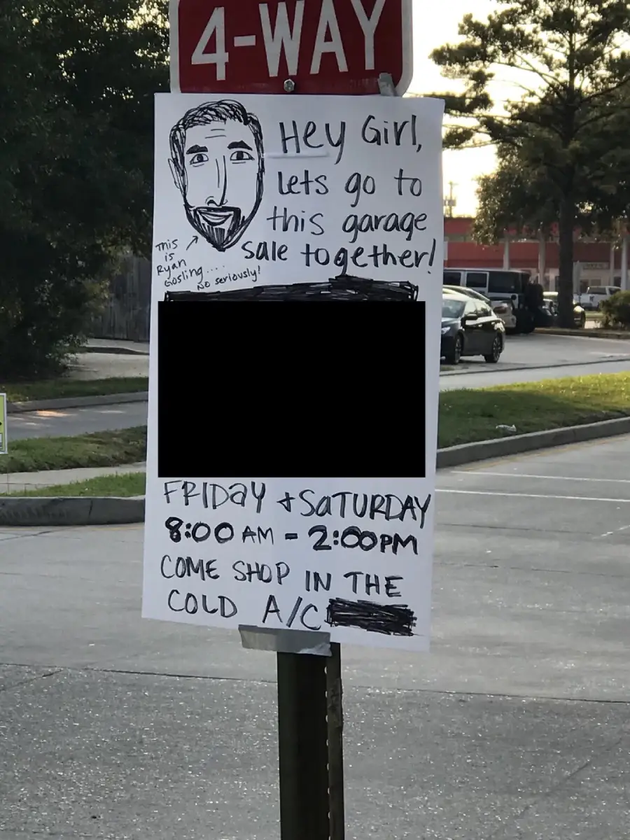 A handmade garage sale sign with a sketch of a bearded man, event details, and a joke about air conditioning. The date, time, and other info are written in marker; some text is blacked out.