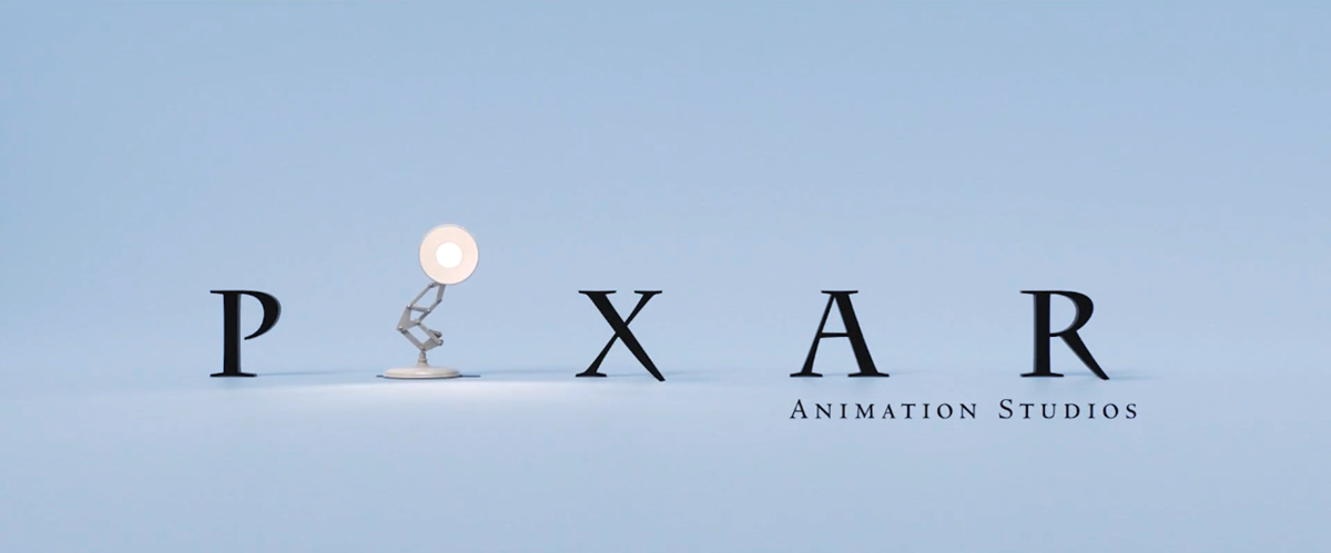 The Pixar Animation Studios logo with a desk lamp replacing the “I” in “PIXAR” against a light blue background.