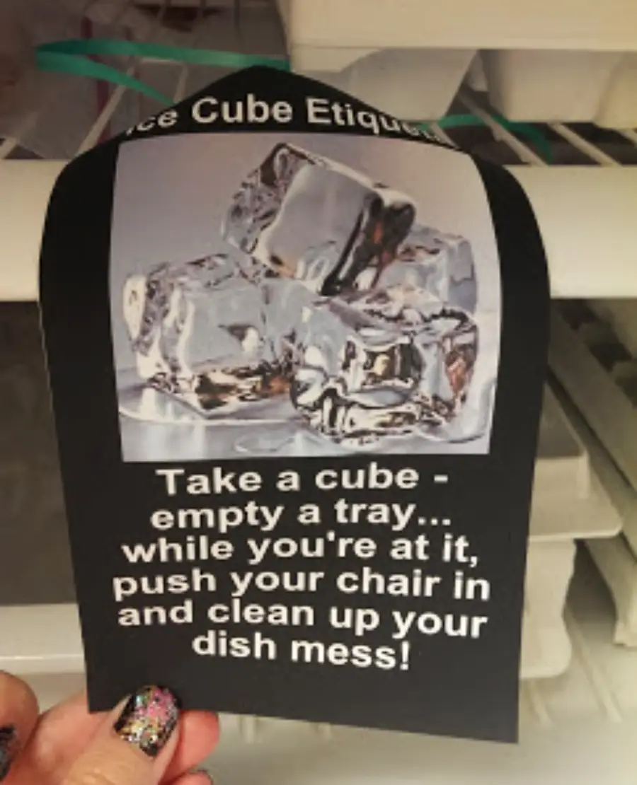 A sign with an image of ice cubes says: “Ice Cube Etiquette: Take a cube - empty a tray... while you’re at it, push your chair in and clean up your dish mess!”