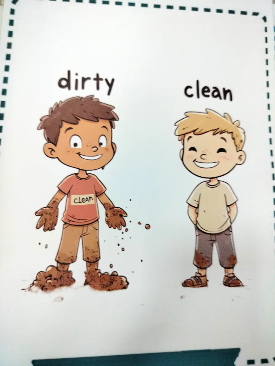 Two smiling boys stand side by side. The boy on the left is dirty, with mud on his hands, feet, and clothes. The boy on the right is clean, with only a little mud on his shoes and lower shorts.