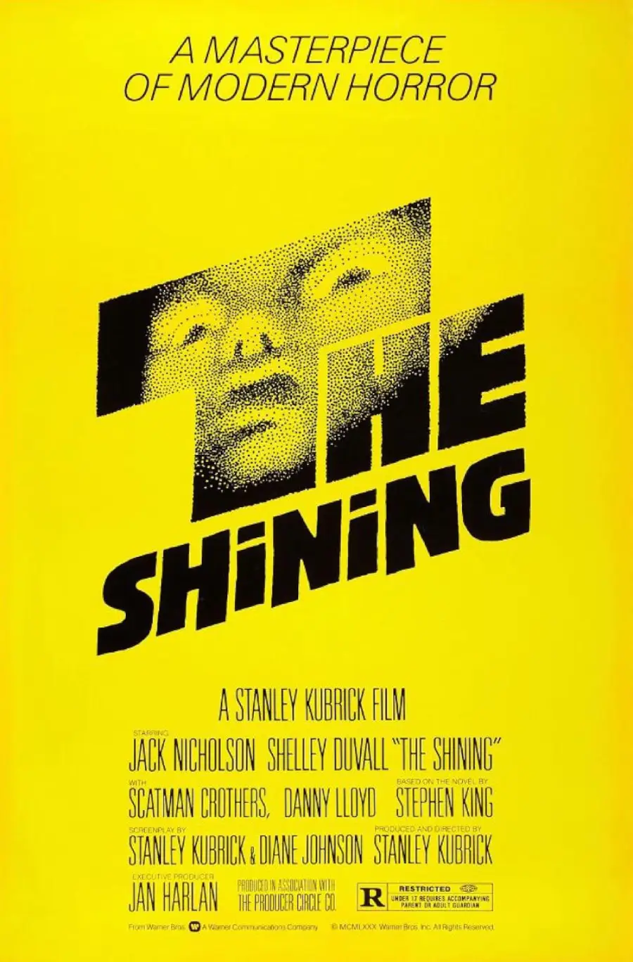 Yellow poster for “The Shining” with a pixelated face above the stylized title. Tagline reads “A Masterpiece of Modern Horror.” Cast and crew information is listed at the bottom.