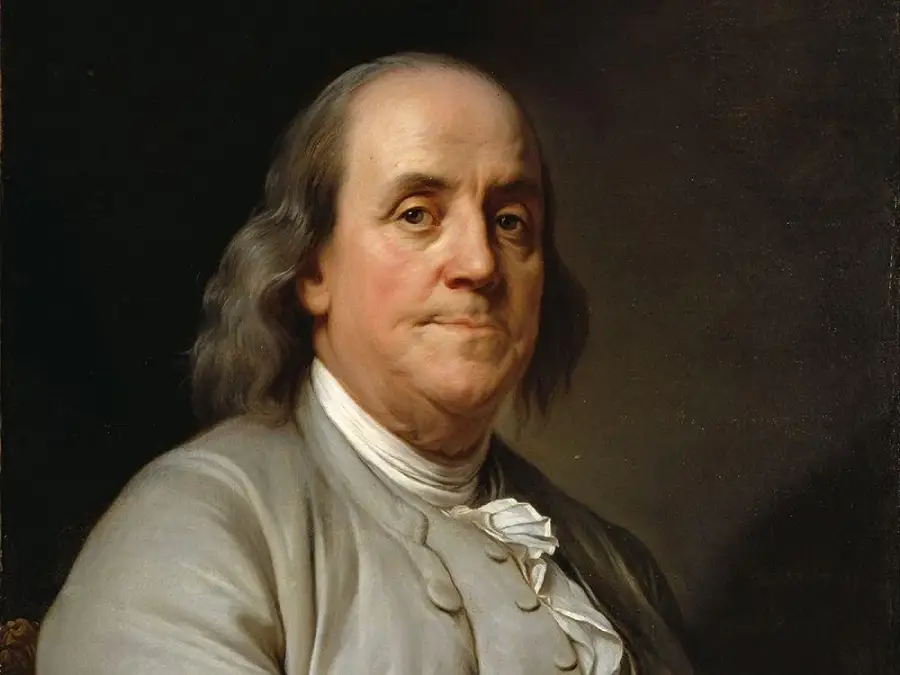 A painted portrait of an older man with long gray hair, wearing a light gray coat and a white shirt, looking directly at the viewer against a dark background.