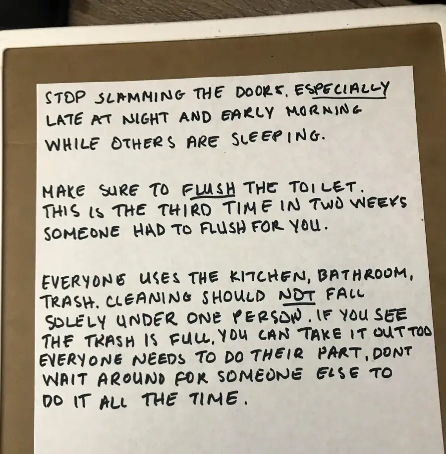 A handwritten note with reminders about not slamming doors, flushing the toilet, and sharing cleaning duties in the kitchen, bathroom, and trash. Some words are emphasized in all caps or underlined.