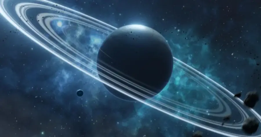 A planet with prominent rings orbits in space, surrounded by stars, nebulae, and small asteroids. A smaller moon or planet appears nearby against a blue and black cosmic background.