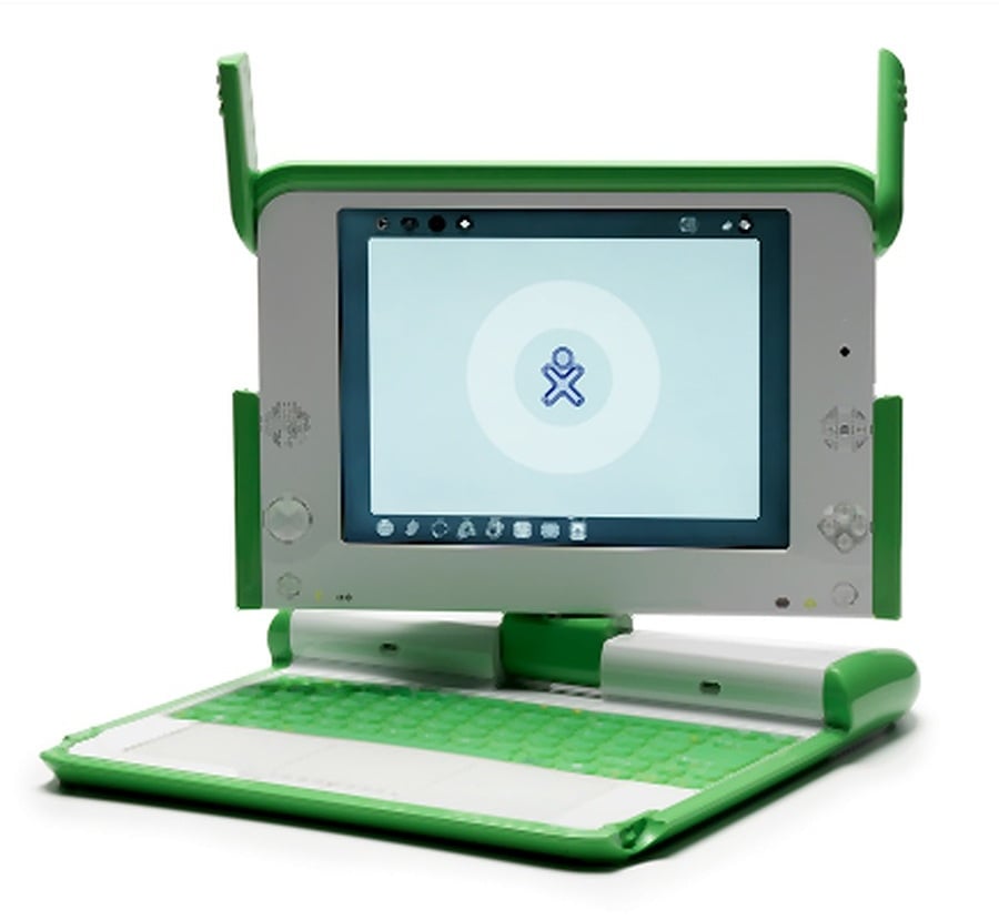 A small green and white laptop with a thick frame, distinctive green “ears” on the sides, and a screen displaying a simple logo. The device has a green keyboard and a unique, sturdy design.