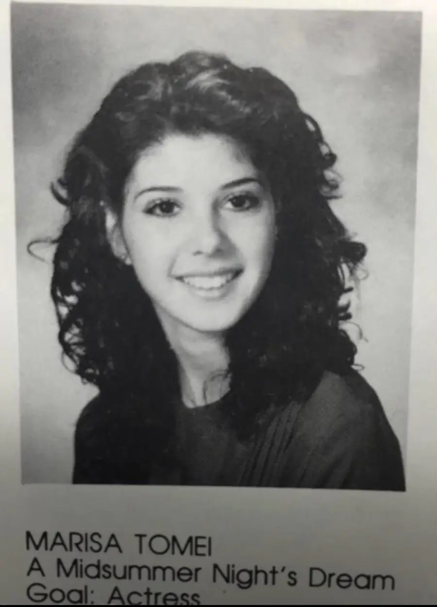 Black-and-white yearbook photo of a young woman with curly hair, smiling. Below the image, text reads: “MARISA TOMEI A Midsummer Night’s Dream Goal: Actress.”