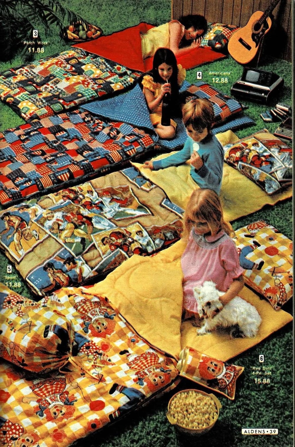 Four children sit on colorful sleeping bags in a backyard.