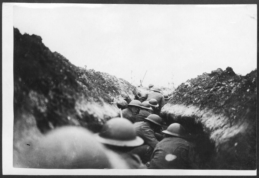 Soldiers waiting in a World War I trench before an attack