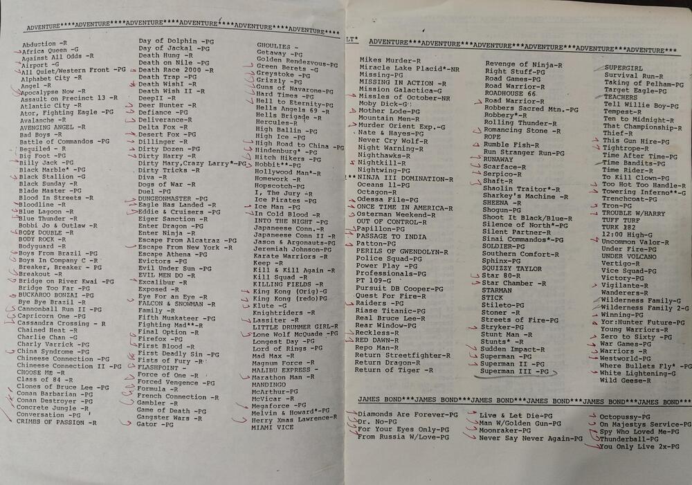 A two-page printed catalog of movie titles organized into categories.