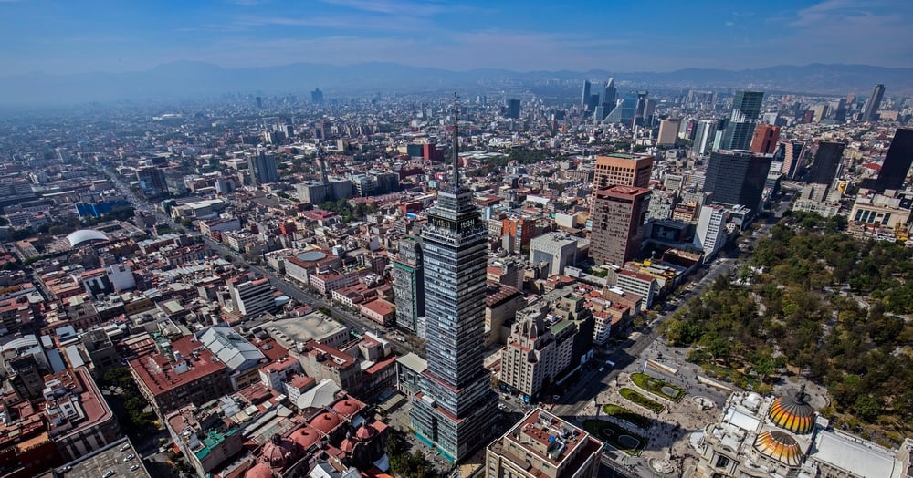 Aerial view of Mexico City showing Torre Latinoamericana and surrounding buildings.