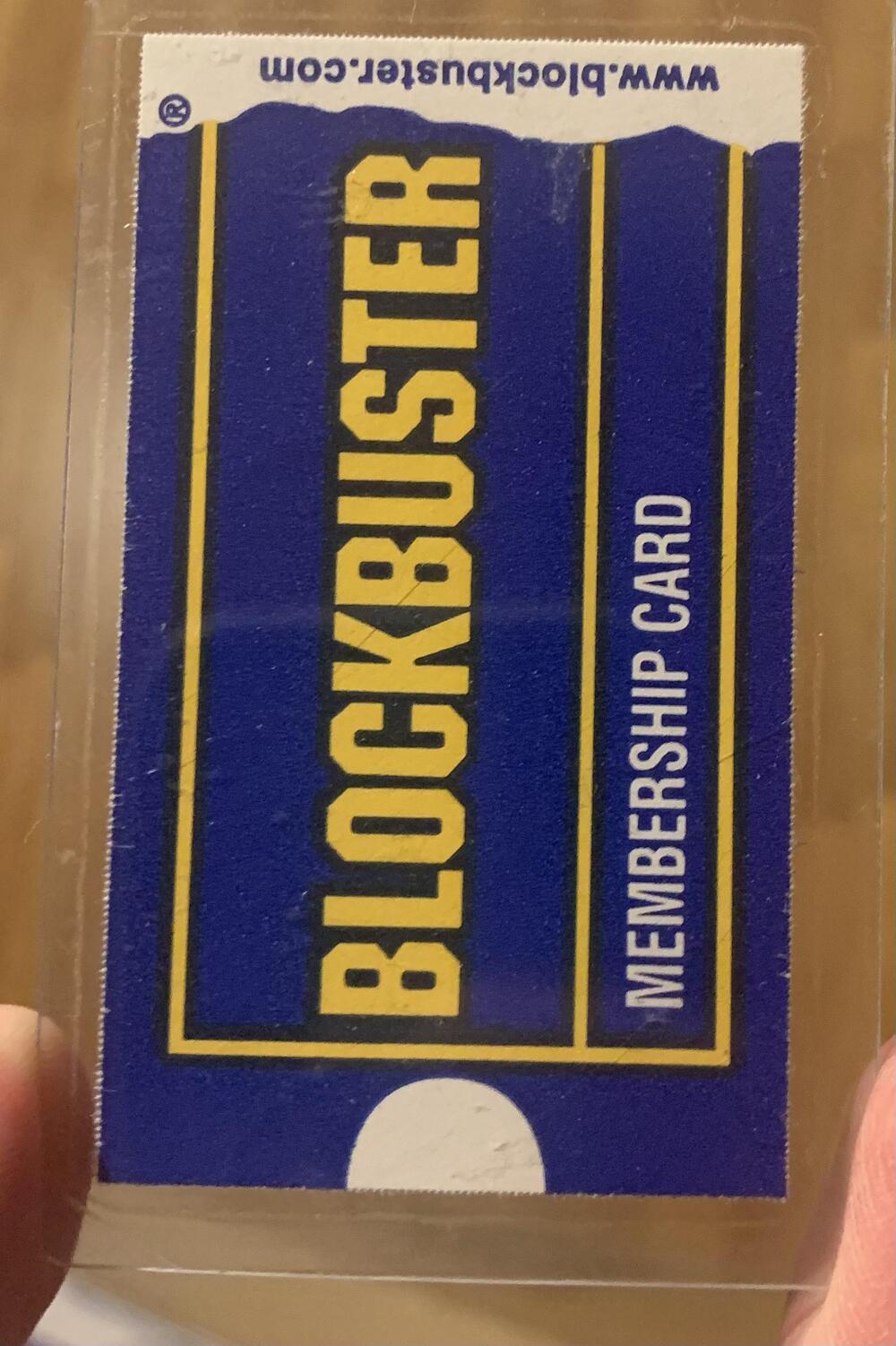 A Blockbuster membership card in a protective sleeve.