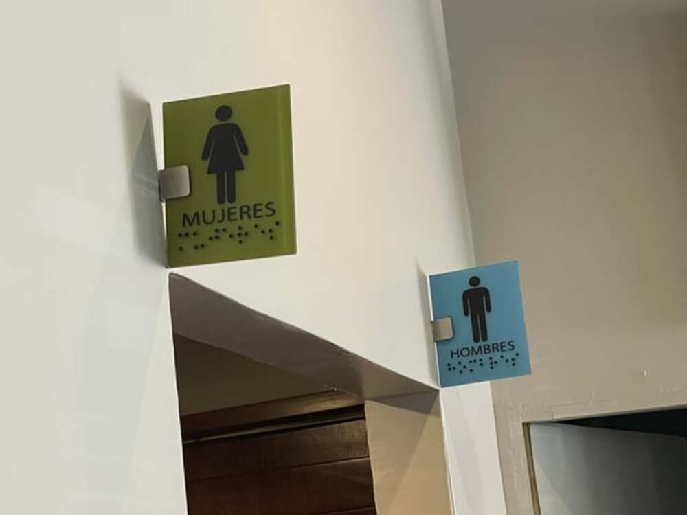 A Restroom Sign Placed Too High