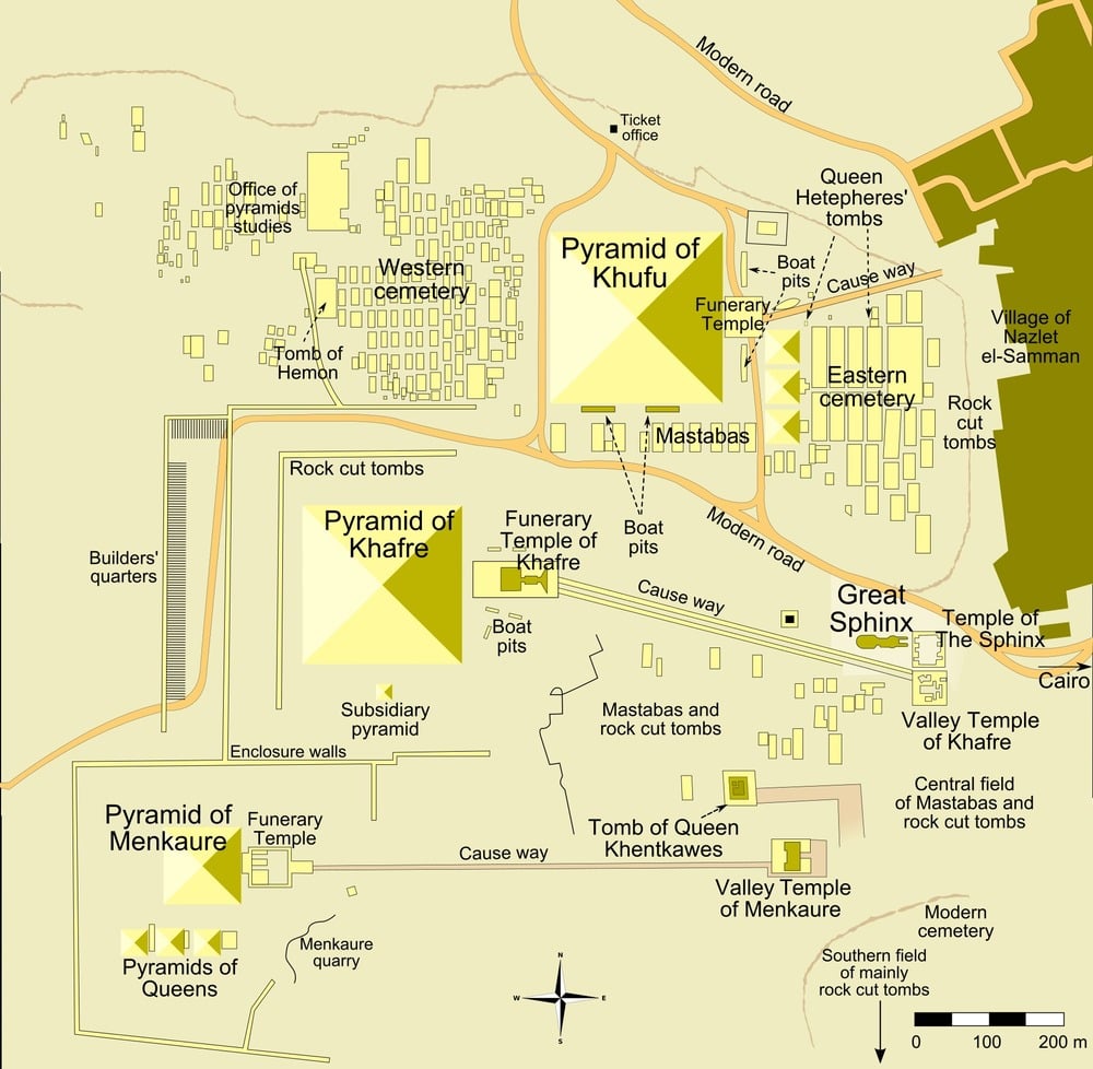 Map showing the Giza pyramid complex, including the Pyramids of Khufu, Khafre, and Menkaure, the Sphinx, cemeteries, temples, boat pits, roads, and labeled features in English.