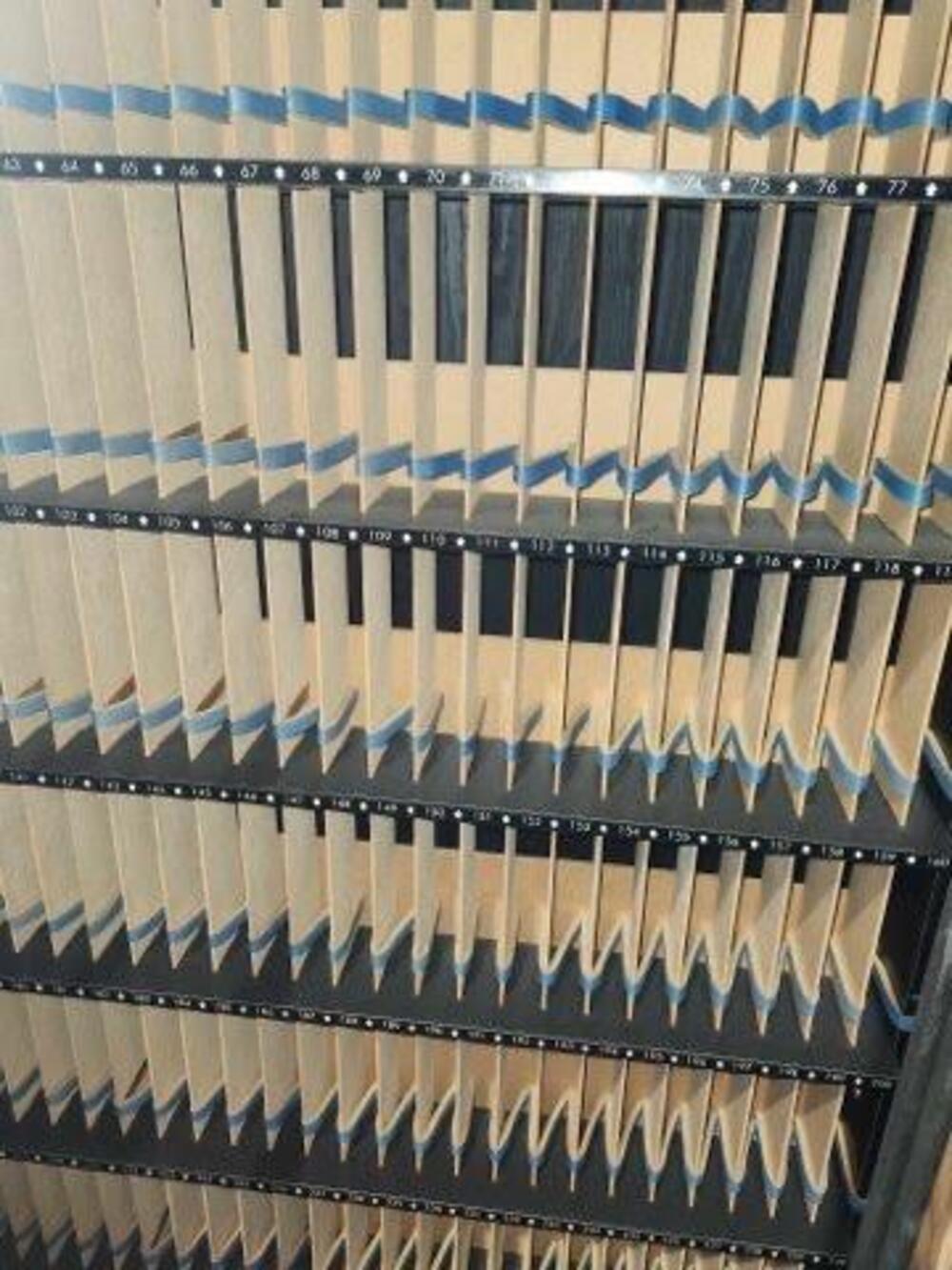 Numbered cassette slots in a Video Vendor rental system.