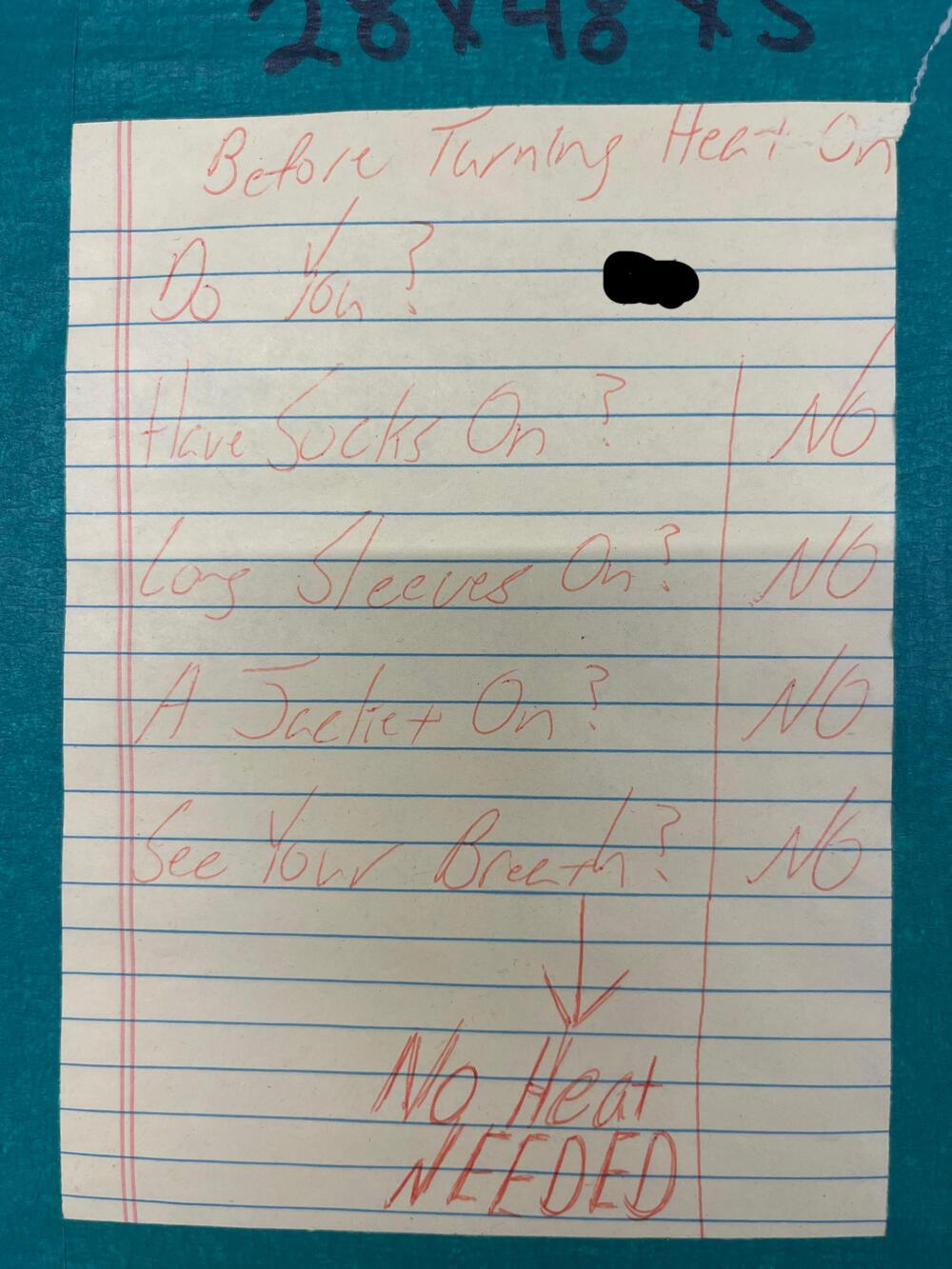 Handwritten note with checklist: “Do you have socks on? Long sleeves on? A jacket on? See your breath?” All answers marked “NO”. At bottom: “No heat NEEDED” in large red letters.