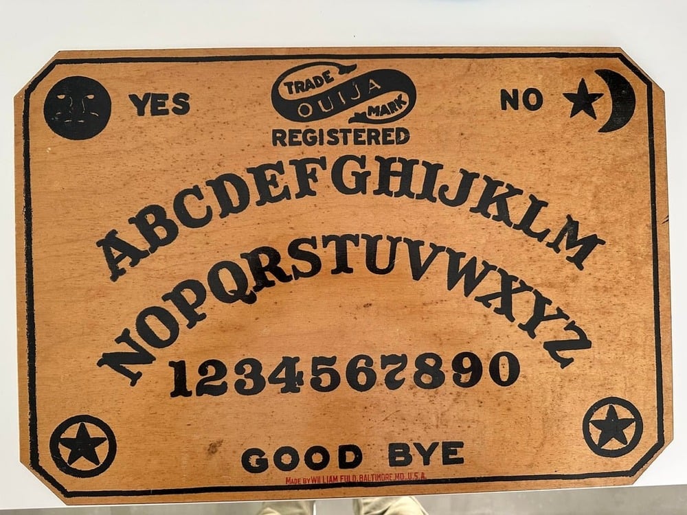 A classic wooden Ouija board.