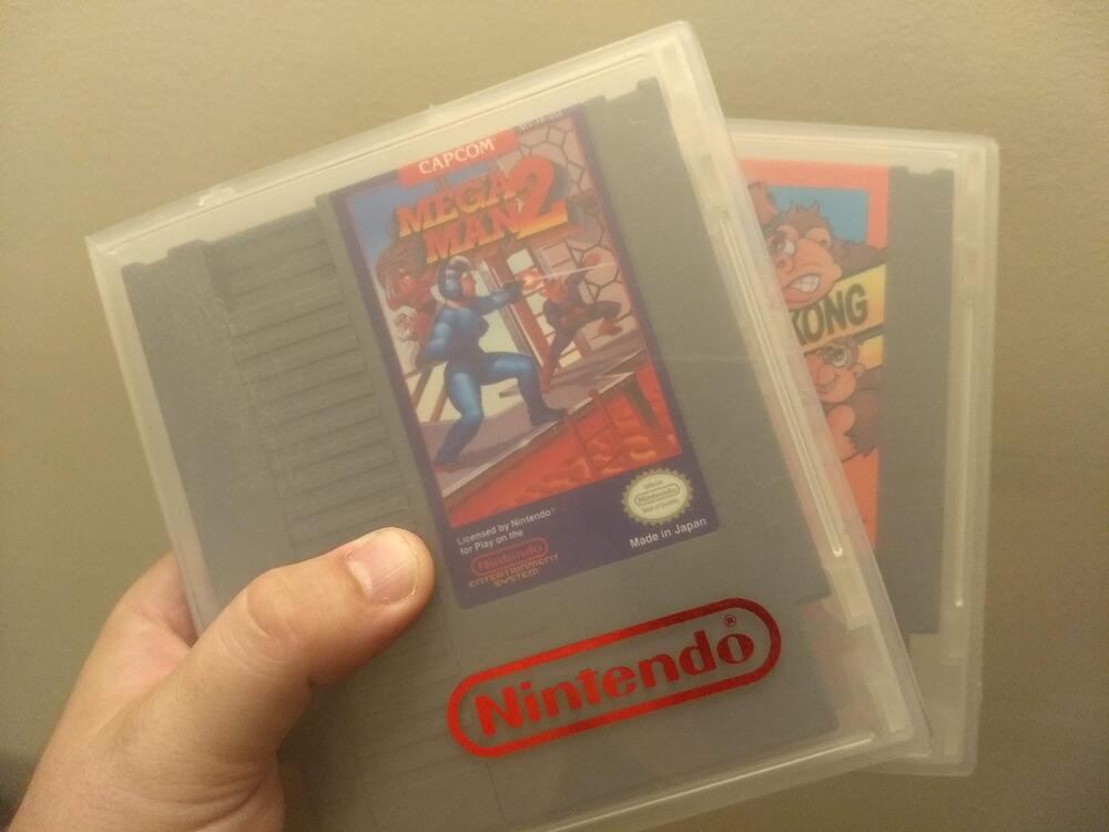 NES games stored in clear rental cases.