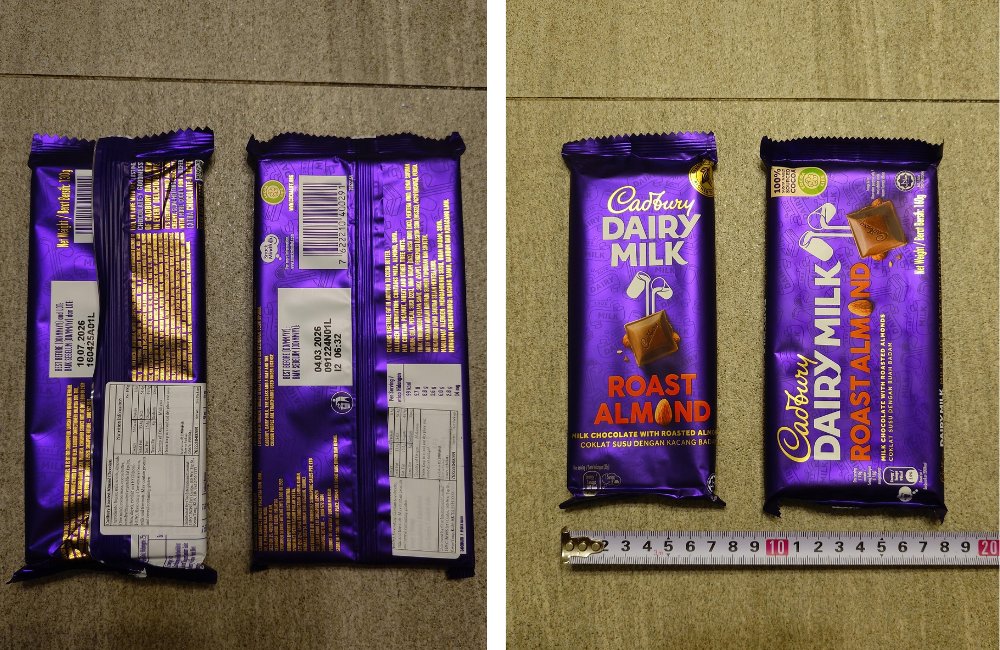 Cadbury Dairy Milk Roast Almond chocolate bars next to a measuring tape.