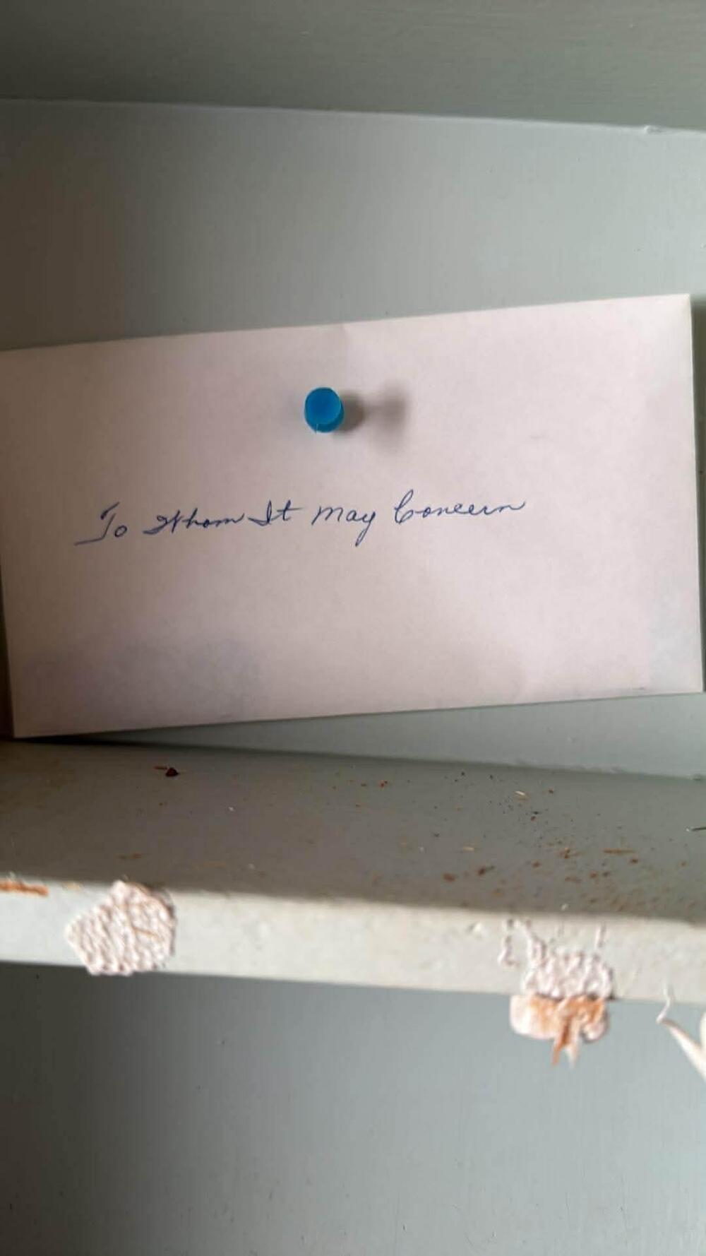 An envelope labeled To Whom It May Concern found in an old structure.