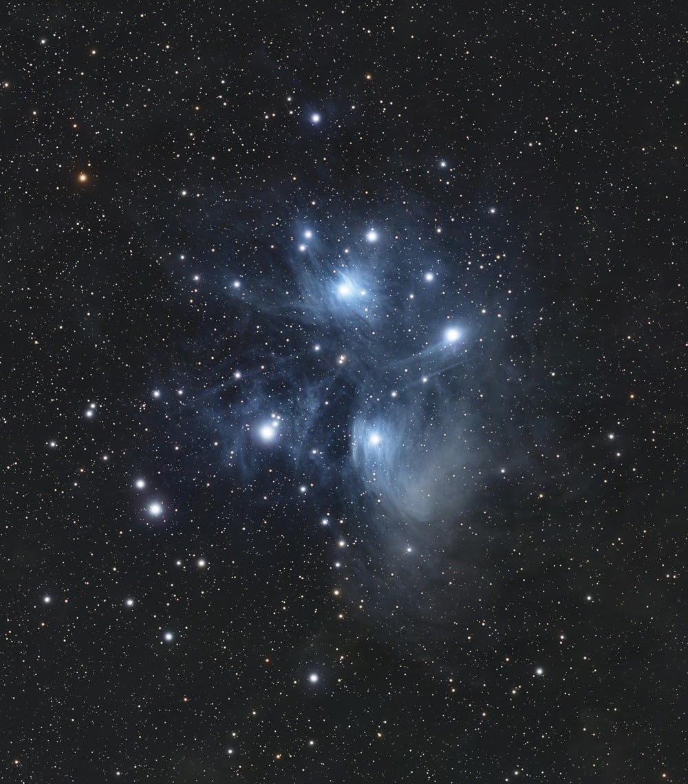 The Pleiades star cluster against a dark sky.