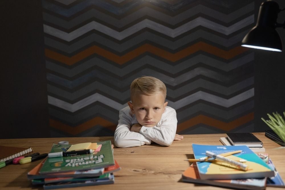Bored child at a desk