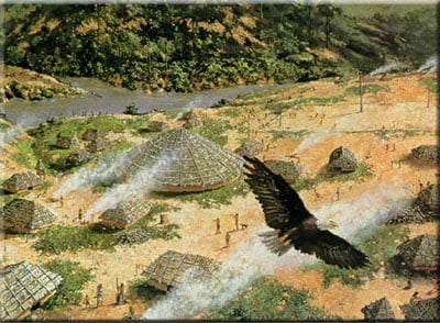 A large bird flies over a village with round, thatched-roof huts. Smoke rises from fires among lush green hills and a river, with people visible throughout the settlement.