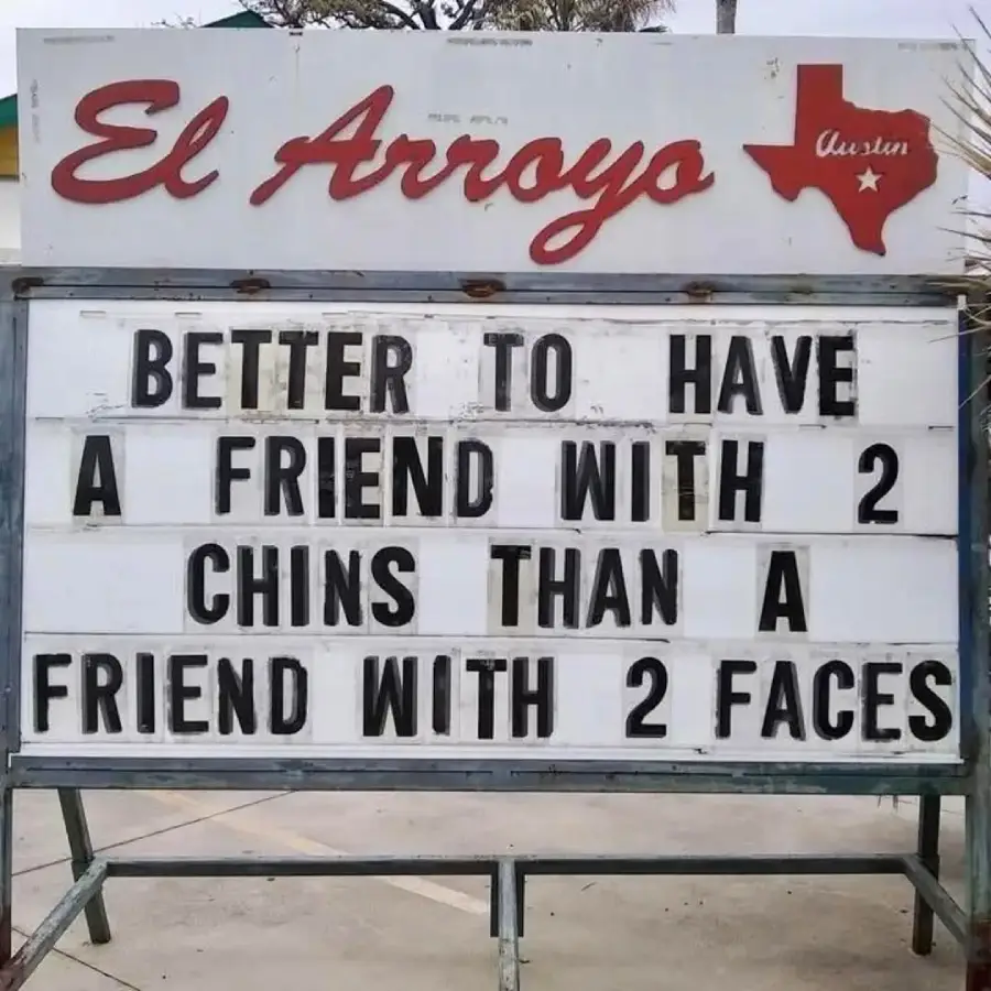 A sign reads: “Better to have a friend with 2 chins than a friend with 2 faces.” The sign is from El Arroyo in Austin, Texas.