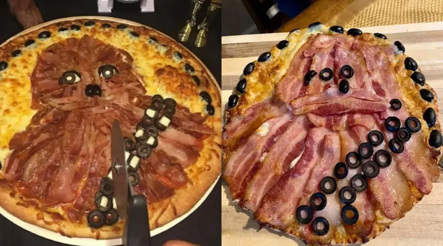 Two pizzas topped with bacon, olives, and cheese are styled to look like Chewbacca from Star Wars. One pizza appears neat and precise, while the other looks more messy and less detailed.
