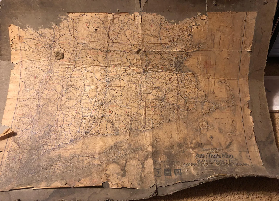 A worn, vintage map labeled “Auto Trails Map” showing Massachusetts, Connecticut, and Rhode Island, with faded highways and roads, creases, and discoloration from age.