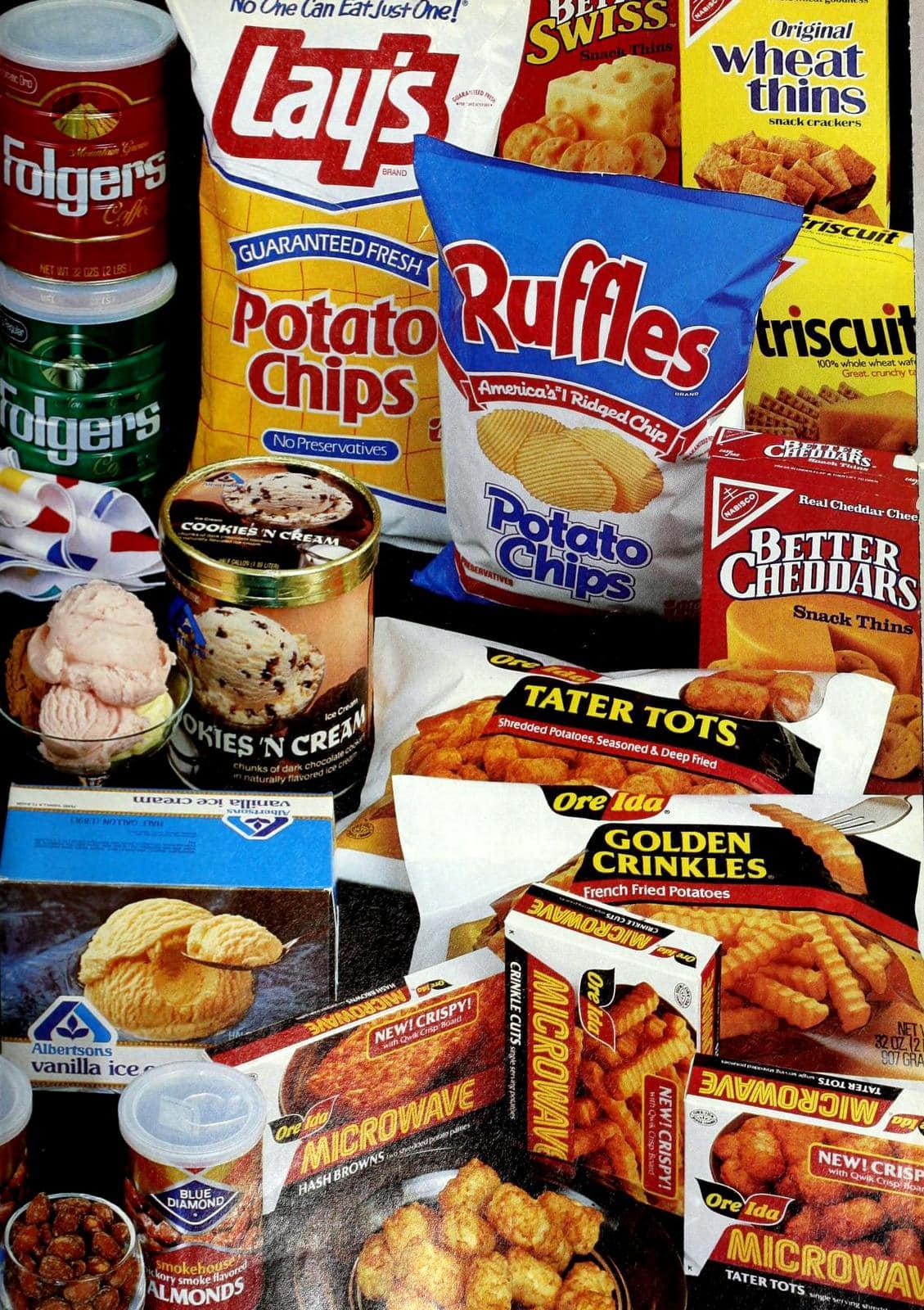 An assortment of packaged snacks and frozen foods, including chips, tater tots, ice cream, cookies, crackers, and canned coffee, arranged closely together.